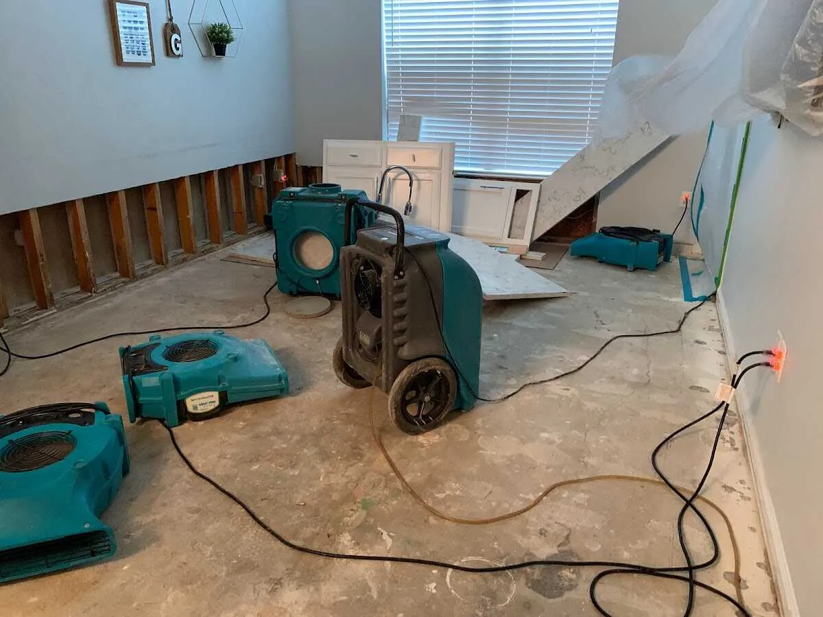 Dehumidifier in flood-cut room for Water Damage Restoration in Norcross